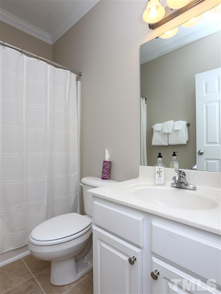 2220 Karns Place Raleigh, NC 27614 - Photo 7 of 25 a bathroom with a sink a toilet and vanity