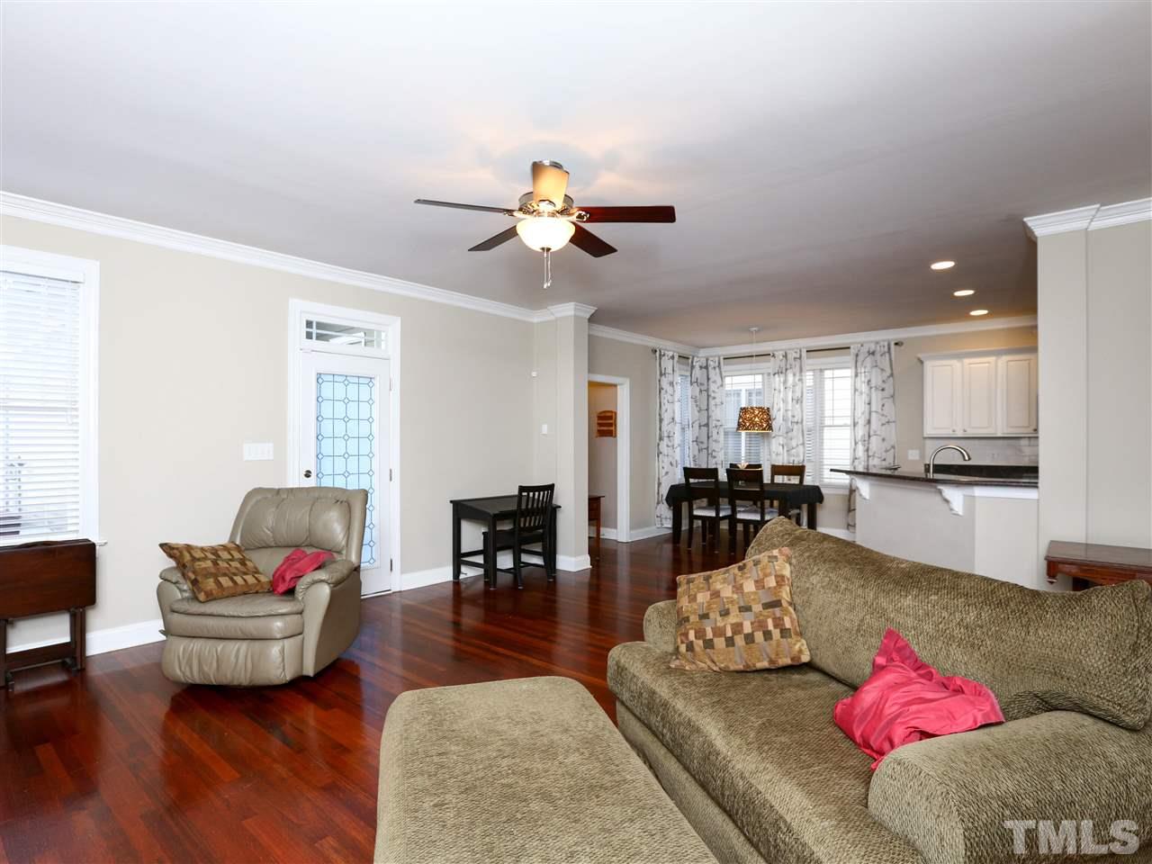 2220 Karns Place Raleigh, NC 27614 - Photo 9 of 25 a living room with furniture or couch and a dining table with wooden floor