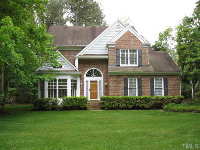 704 Manor Ridge Road Carrboro, NC 27510 - Photo 1 of 21 a front view of a house with garden