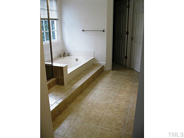 704 Manor Ridge Road Carrboro, NC 27510 - Photo 12 of 21 a bathroom with a bathtub and a sink