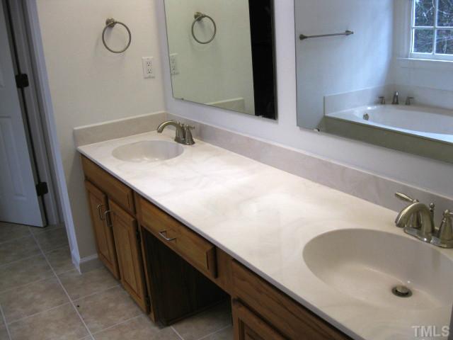 704 Manor Ridge Road Carrboro, NC 27510 - Photo 13 of 21 a bathroom with a sink and a mirror