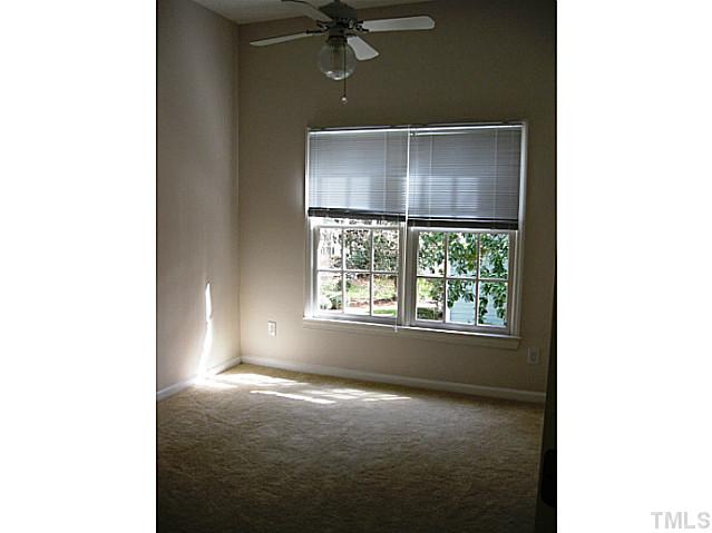 704 Manor Ridge Road Carrboro, NC 27510 - Photo 15 of 21 a view of a livingroom with a ceiling fan and window