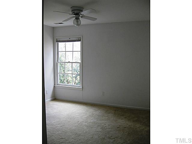 704 Manor Ridge Road Carrboro, NC 27510 - Photo 16 of 21 a view of room with a ceiling fan and window