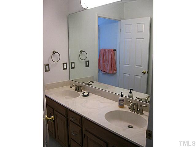 704 Manor Ridge Road Carrboro, NC 27510 - Photo 18 of 21 a bathroom with a sink and a mirror