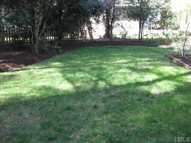 704 Manor Ridge Road Carrboro, NC 27510 - Photo 19 of 21 a view of outdoor space with deck area and trees all around