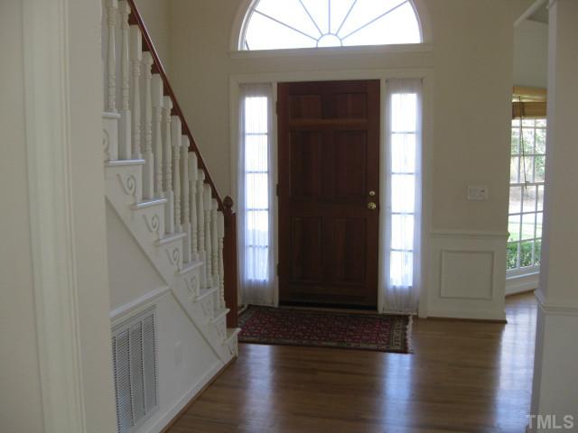 704 Manor Ridge Road Carrboro, NC 27510 - Photo 2 of 21 a view of an entryway with wooden floor and stairs