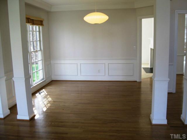 704 Manor Ridge Road Carrboro, NC 27510 - Photo 4 of 21 a view of water heater room with wooden floor