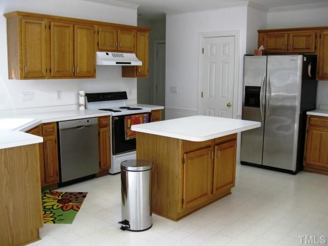 704 Manor Ridge Road Carrboro, NC 27510 - Photo 6 of 21 a kitchen with stainless steel appliances granite countertop a stove a refrigerator and a refrigerator