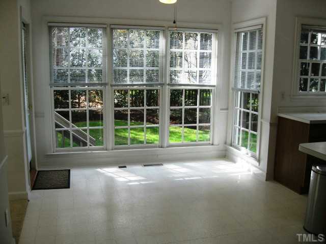 704 Manor Ridge Road Carrboro, NC 27510 - Photo 7 of 21 a view of empty room with windows and floor to ceiling window