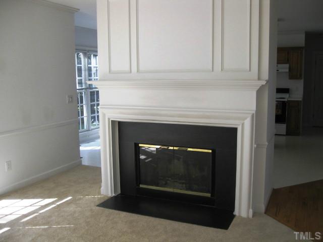 704 Manor Ridge Road Carrboro, NC 27510 - Photo 9 of 21 a living room with a fireplace