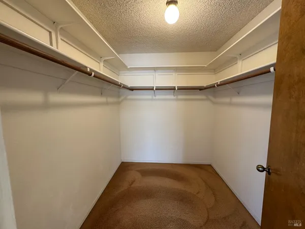 a view of a room with racks on the wall