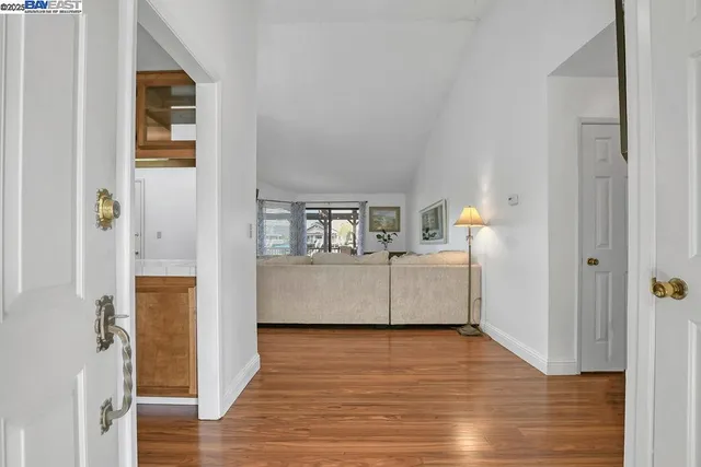 a bathroom with a granite countertop sink and a large mirror