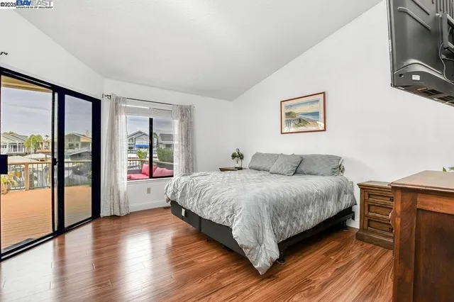 a white toilet sitting next to a shower