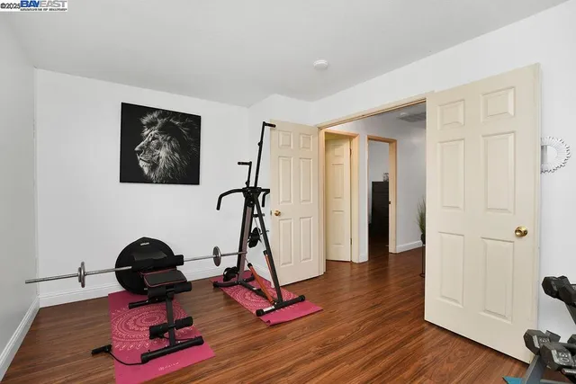 a view of a hallway with paintings on the wall
