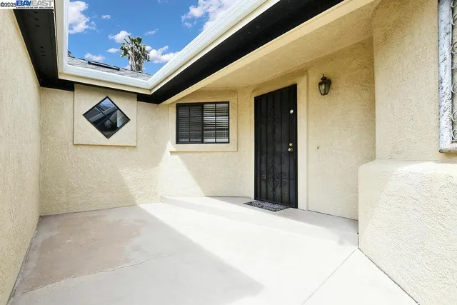 a view of a patio with dining table and chairs with a wooden deck