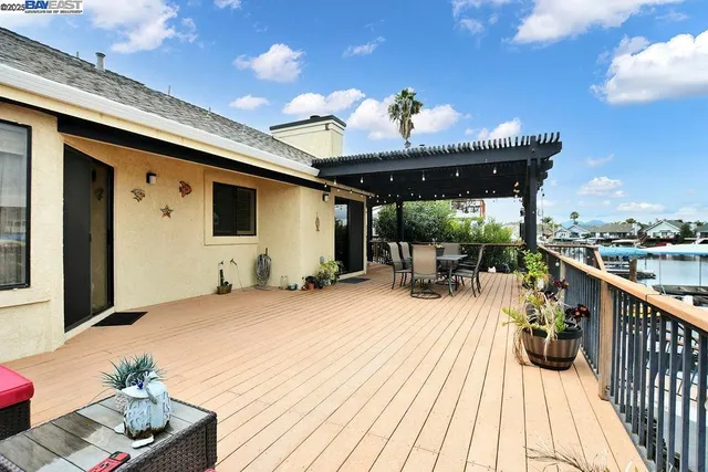 a view of roof deck with patio