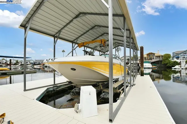 a view of swimming pool with outdoor seating and city view