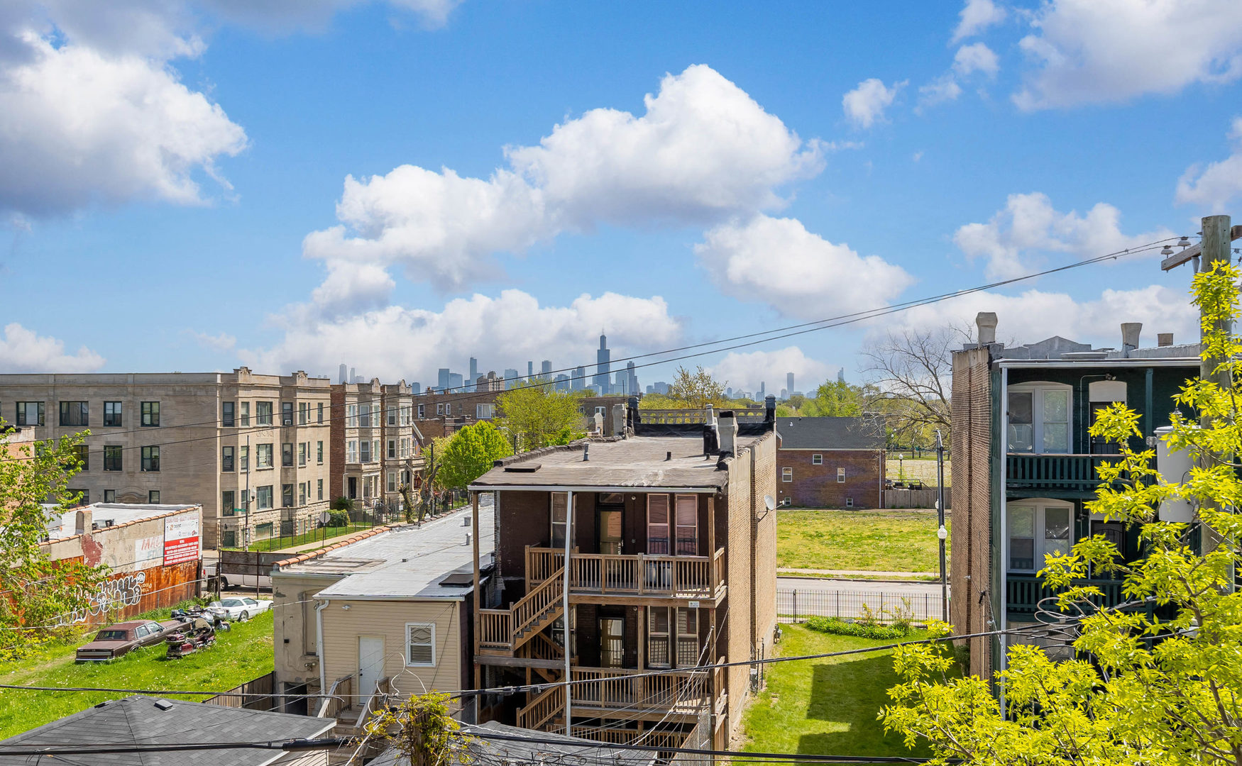 1321 South Millard Avenue, Unit C Chicago, IL 60623 - Photo 12 of 13 a view of a house with a swimming pool and outdoor seating