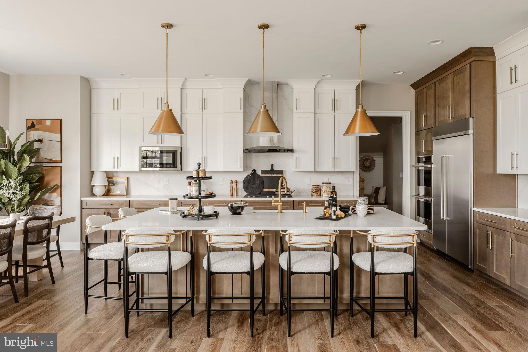 1100 Dietz Road, Unit DEVONSHIRE York, PA 17402 - Photo 15 of 50 a view of a dining room and livingroom with furniture wooden floor a chandelier