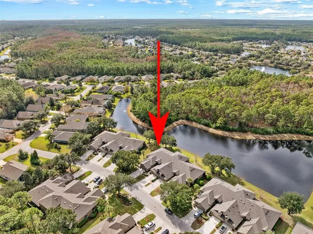 an aerial view of lake residential house with outdoor space