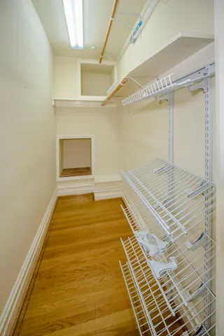 a kitchen with a sink a counter top space and living room view