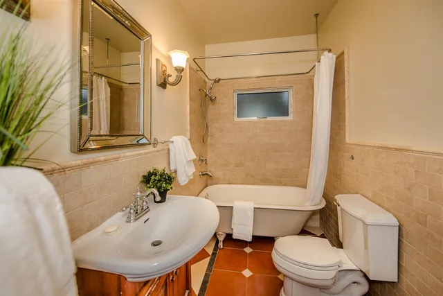 a bathroom with a sink toilet and bathtub