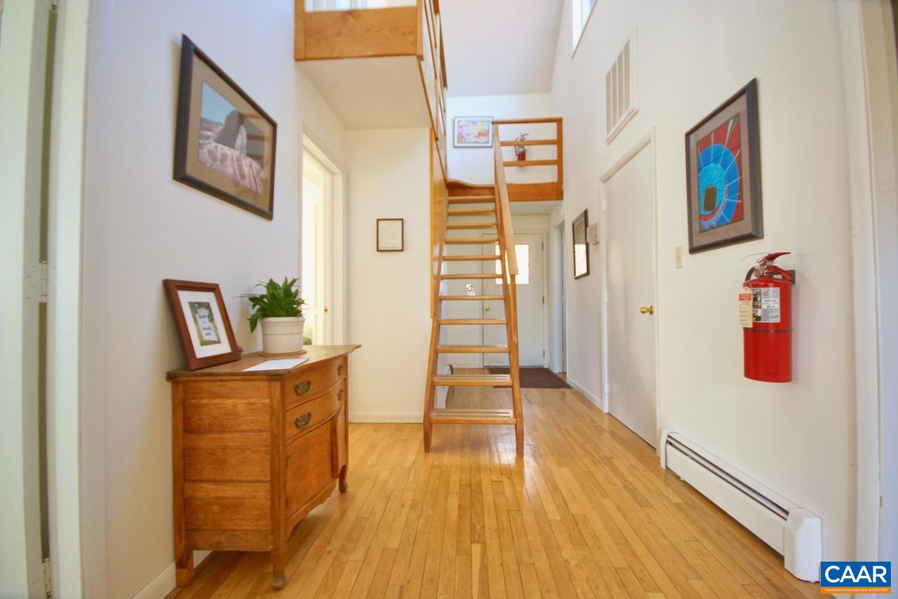 403 Pathwork Way Madison, VA 22727 - Photo 18 of 30 a view of a hallway with wooden floor and furniture