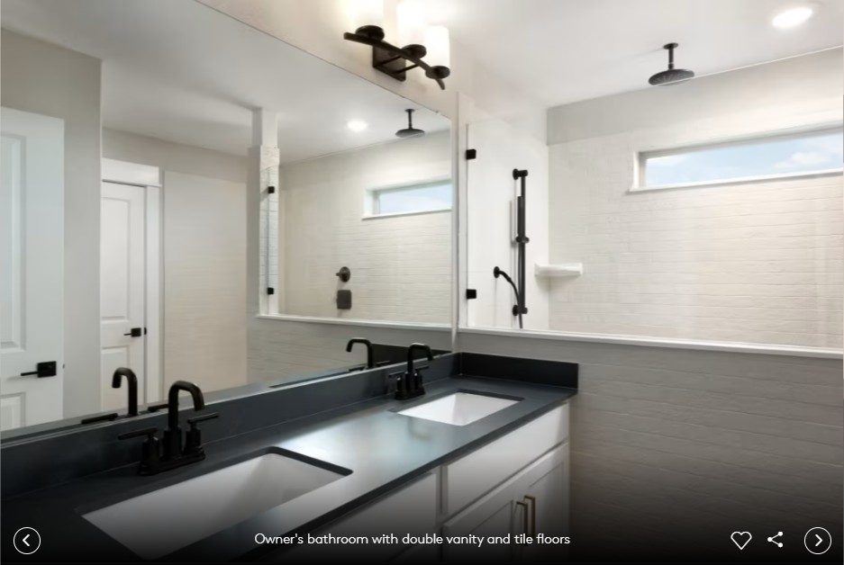 421 Windward View Leander, TX 78641 - Photo 6 of 7 a bathroom with a granite countertop sink a mirror and shower