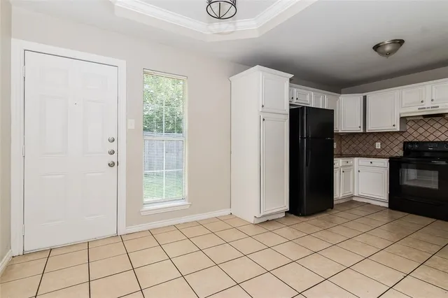 a kitchen with stainless steel appliances a refrigerator and a sink