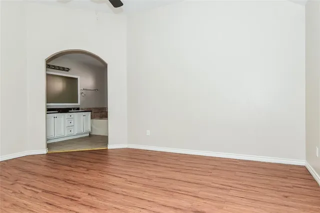 a view of a hardwood floor in a room