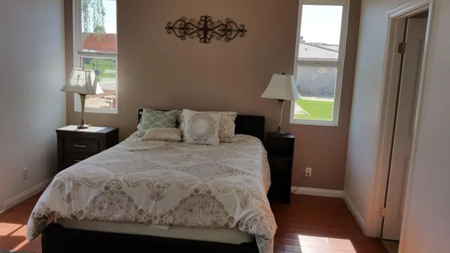 a bedroom with a bed and a window