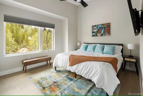 a bedroom with a bed and a window