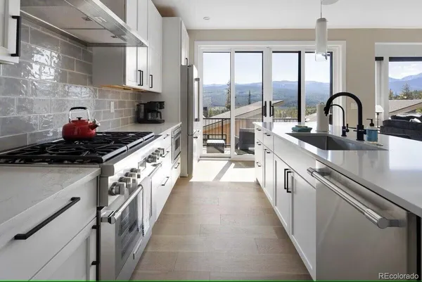 a kitchen with a sink and cabinets