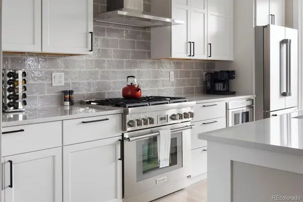 a kitchen with cabinets a stainless steel appliances and sink