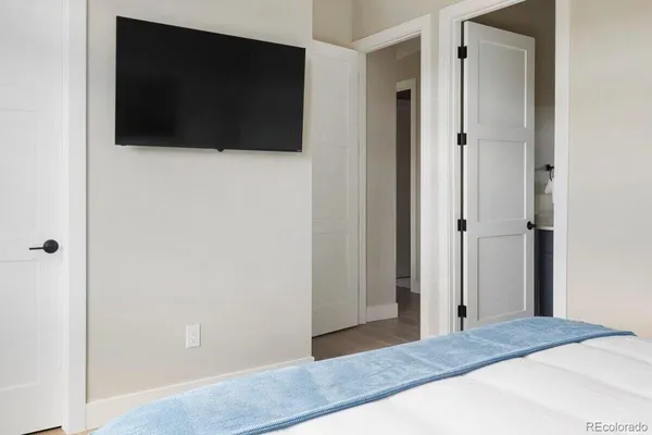 a view of a bedroom from a hallway