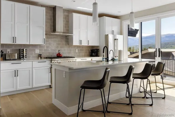a kitchen with a sink cabinets and window