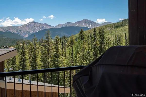 a view of a balcony with an outdoor space and seating
