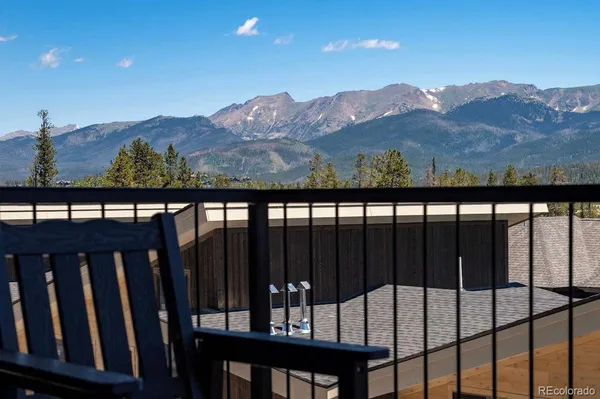 a view of a balcony with a forest
