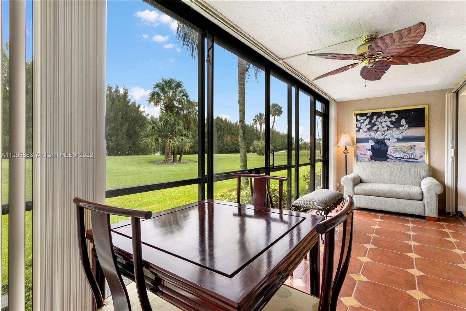 101 Pinecrest Circle, Unit E Jupiter, FL 33458 - Photo 9 of 20 a view of a livingroom with furniture and a potted plant
