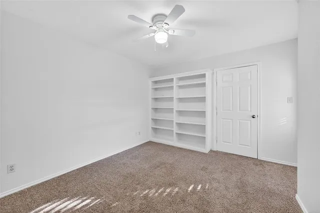 a view of a big room with carpet