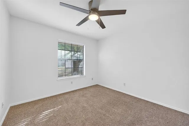 a bathroom with a toilet a sink and a mirror