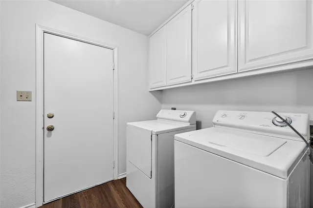 a view of a house with a yard and garage