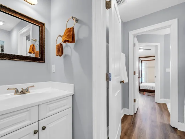 a en suite bathroom with a toilet sink and mirror