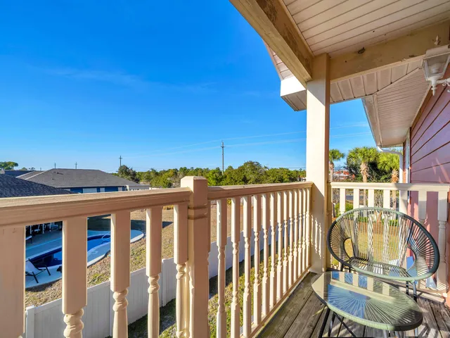 a view of a balcony with furniture
