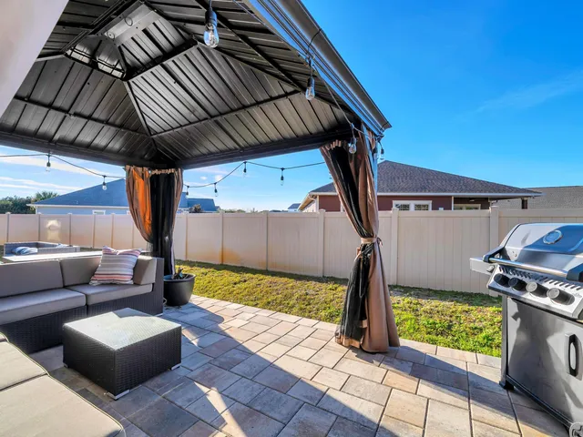 a backyard of a house with seating space