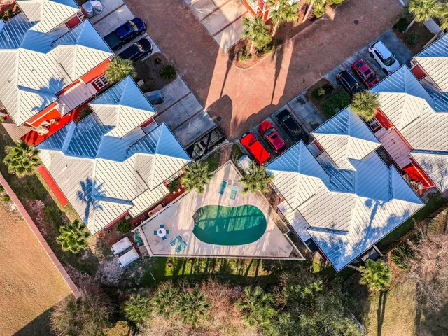 an aerial view of a house swimming pool patio and outdoor seating