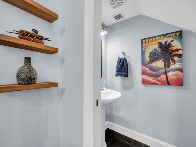 a bathroom with a sink and mirror