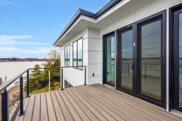 a view of a balcony with wooden floor
