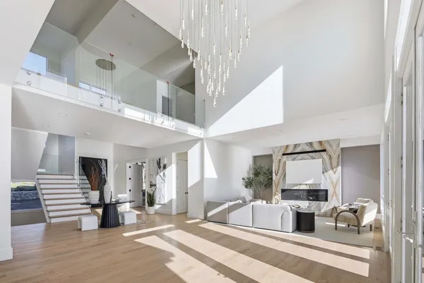 a lobby with furniture and floor to ceiling window