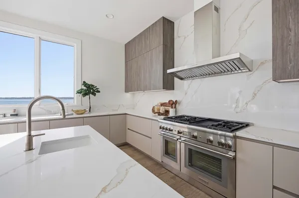 a kitchen with a stove and a sink